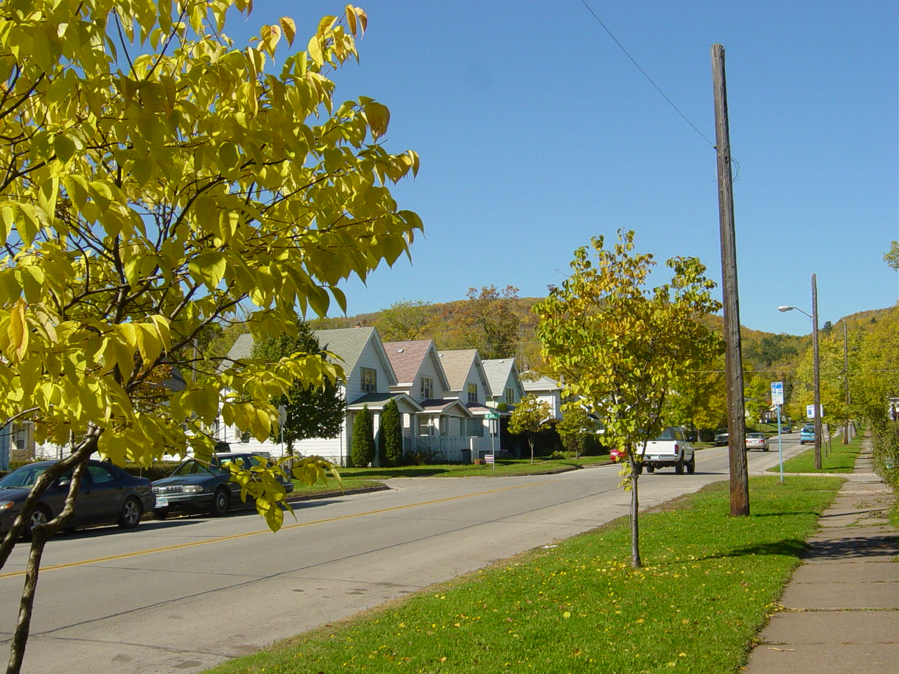 Modest older houses under October foliage on 40th Avenue West in West Duluth