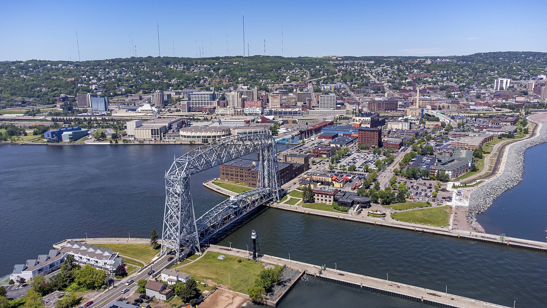 Aerial view of the Aerial Lift Bridge, the Duluth Ship Canal, Canal Park and downtown Duluth beyond