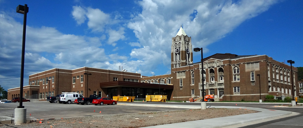 The long stone facade of Denfeld High School in West Duluth with its 2011 addition
