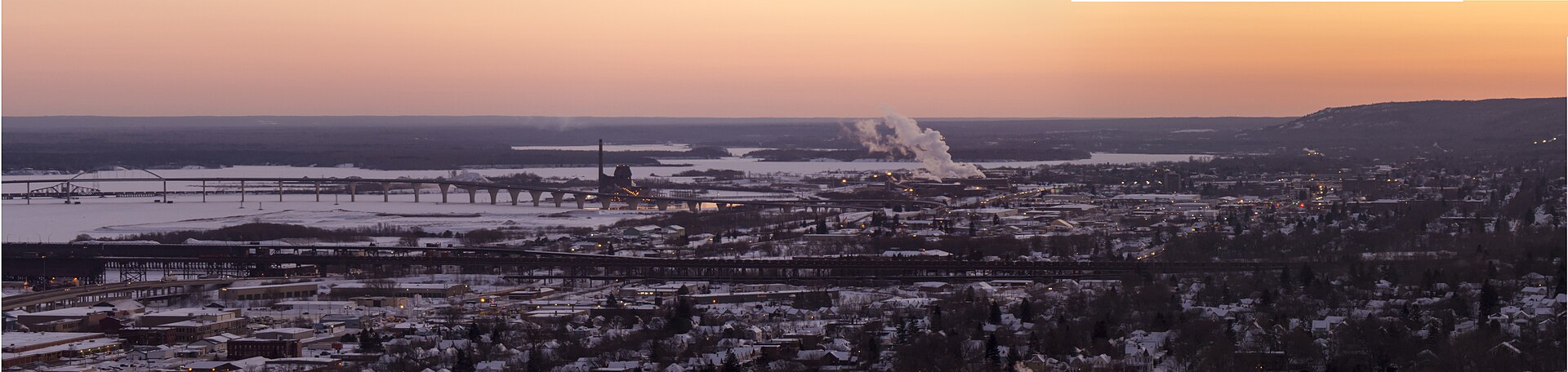Winter panorama from the Duluth hillside over the frozen harbor to the Blatnik Bridge and the Superior, Wisconsin shore beyond